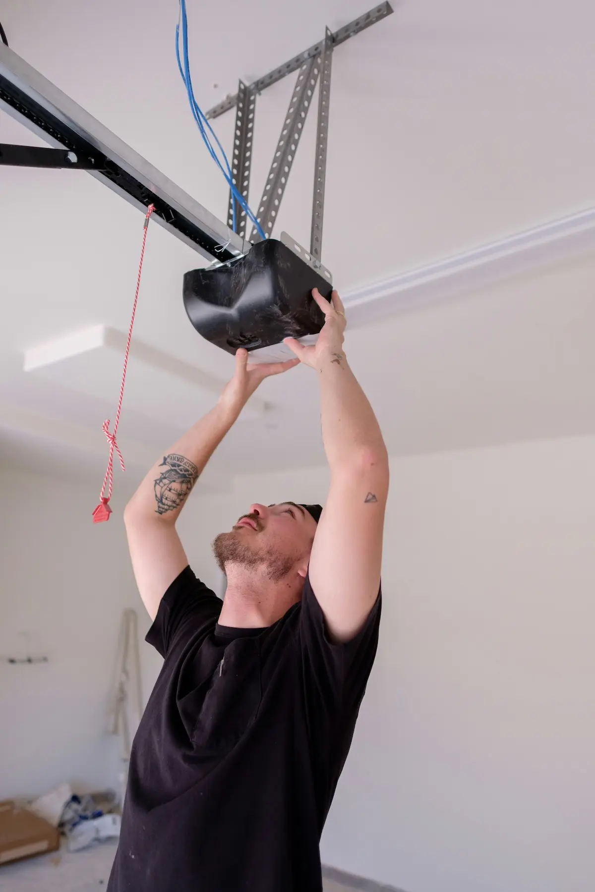 Contractor cutting trim pieces inside a bright room